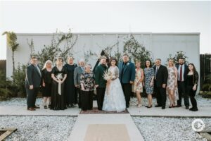 Outdoor wedding ceremony group wedding photo at The Edison Barn.