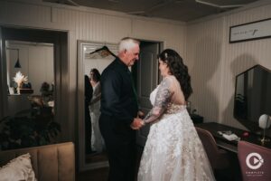 Father of the bride first look with bride at The Edison Barn in Dade City, Florida.